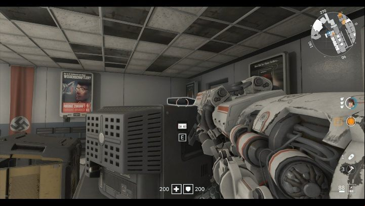 Theres a black cover on a desk next to the supply crate, its on a monitor - Secrets and collectibles in Brother 3 | Wolfenstein Youngblood - Collectibles and secrets - Wolfenstein Youngblood Guide